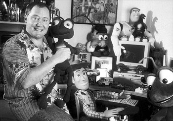 Animation-Pioneer-John-Lasseter-with-Pixar-toys-and-Apple-Mac-computer